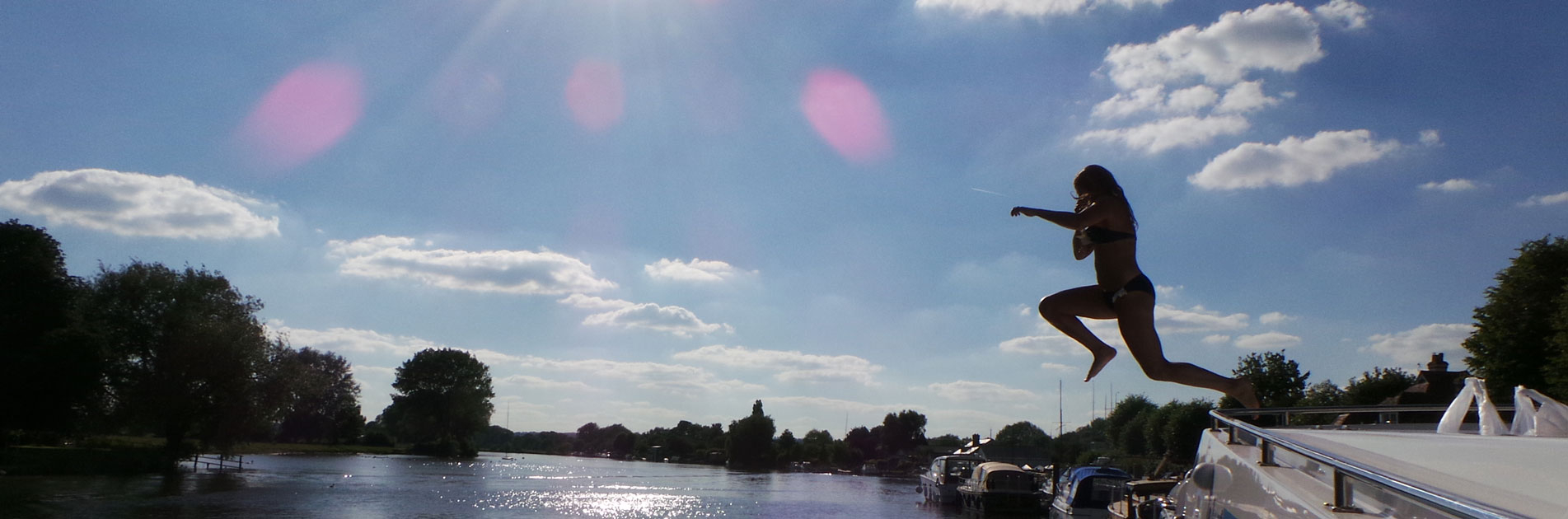 Swimmer jumping in the river near Bristol